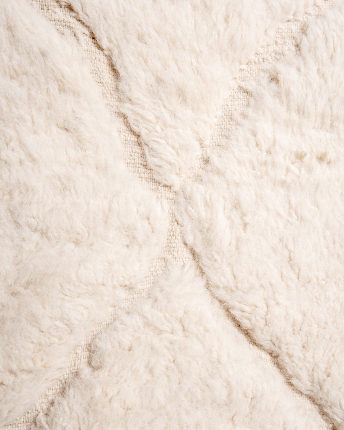 Modern, designer, handcrafted Berber rug from Morocco. Beniourain carpet with minimalist design, natural wool pile and a fluffy texture.
